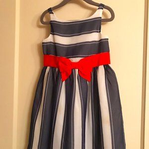 Elegant striped dress with orange bow